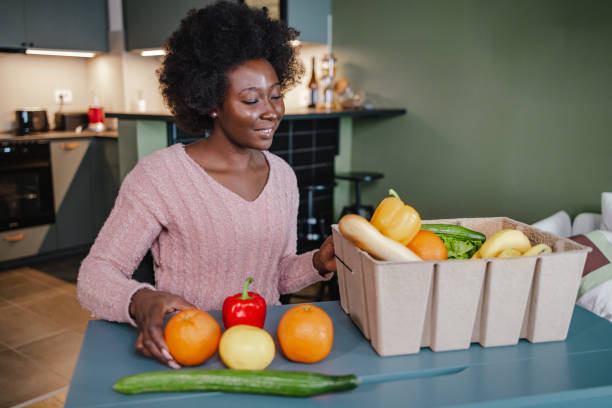 istock Unpacking fresh groceries at home 1368041546