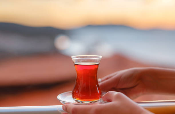 istock Woman drinking turkish tea from traditional turkish teacup 1368042331