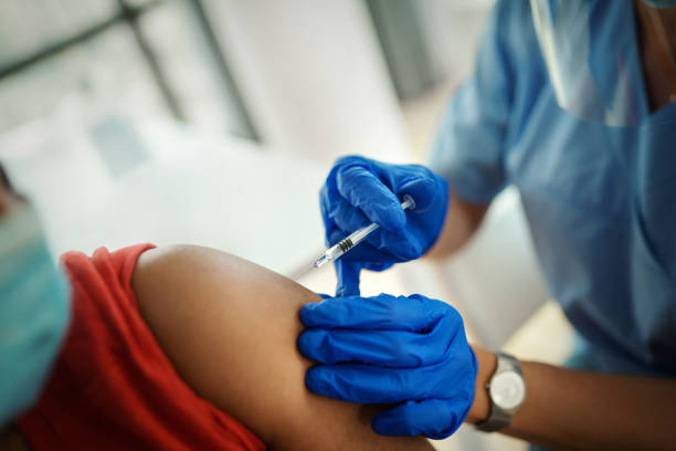 istock Young woman having Covid-19 vaccine. 1368043097