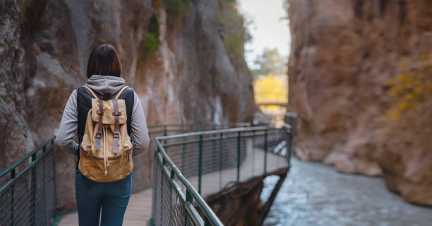 istock Happy asian woman is enjoy active hiking 1368044359