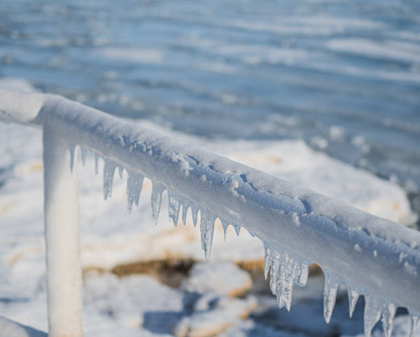 istock frozen metal railing with hanging ice 1368048660