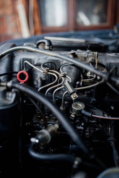 istock Old car engine details in garage. 1368049138