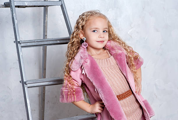 istock Beautiful blonde in pink outfit 136805032