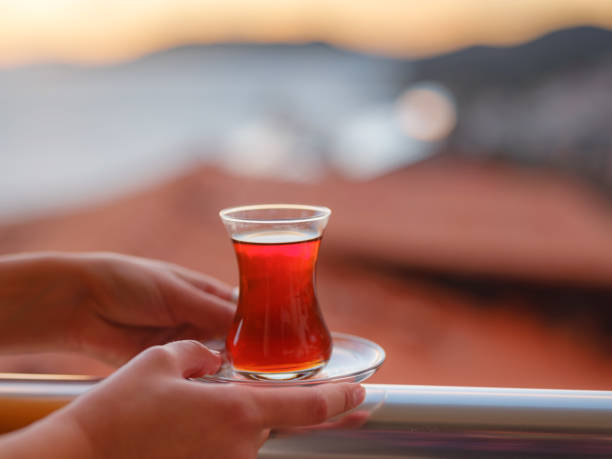 istock Woman drinking turkish tea from traditional turkish teacup 1368052650