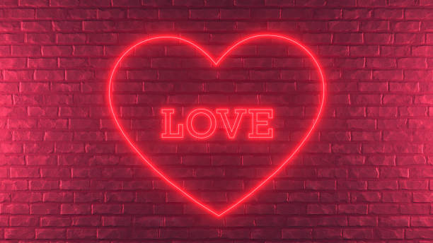 istock Valentine's Day heart shape love text neon lighting brick wall 1368052975