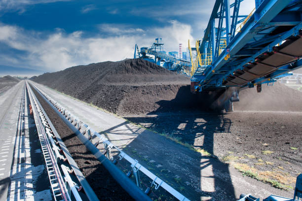 istock Conveyor belt and Coal-fired power station 1368053037