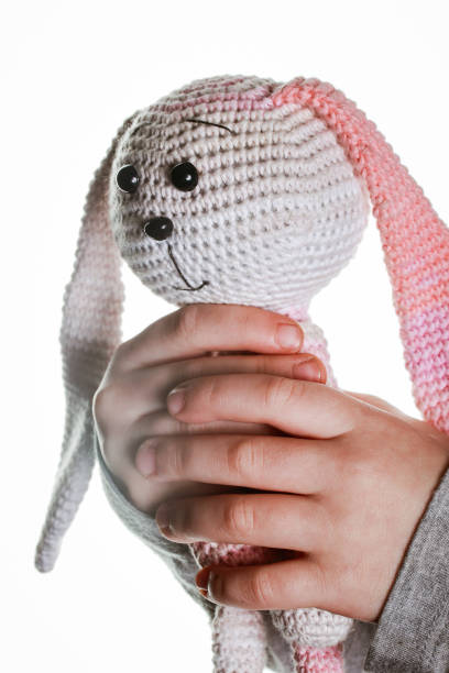 istock hand-knitted toy pink and white bunny 1368053071