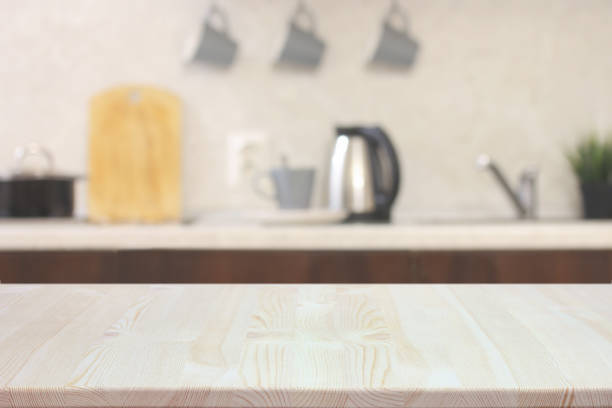 istock empty table on a blurry kitchen background, a wooden countertop. 1368058308