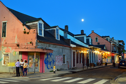 New Orleans, LA< USA June 7 The full moon rises over a row of small houses in the less traveled section of the French Quarter in New Orleans