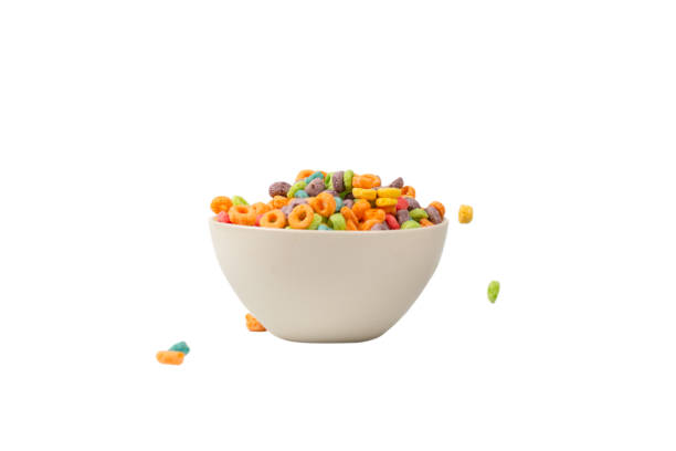 istock Colorful cereal box for morning breakfast. Corn flakes falling to the white bowl. Motion. 1368060011