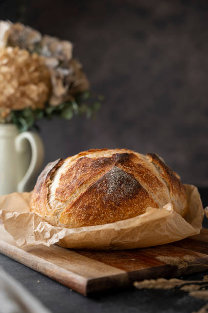 istock Sourdough artisan homemade bread on dark background. 1368060983