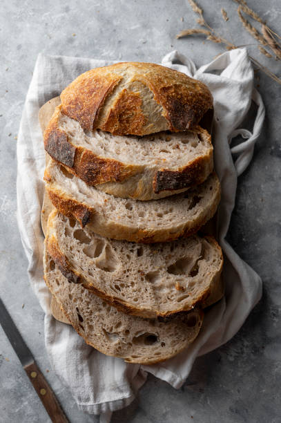 istock Sourdough bread slices, homemade healthy bread, top view. 1368061214