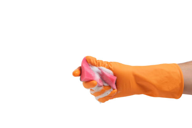 istock Hand in a glove with sponge for wet cleaning on a white background. 1368061532