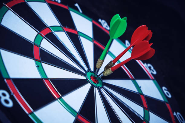 istock Dartboard with three darts stuck right center of the target. 1368061569
