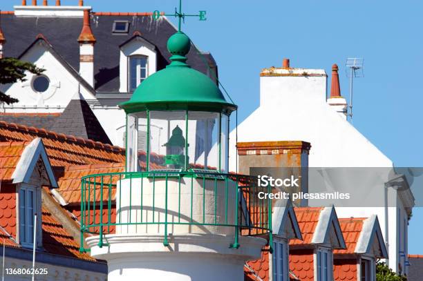 Lighthouse Light And Rooftops Sauzon Harbour La Belle Ile Stock Photo - Download Image Now