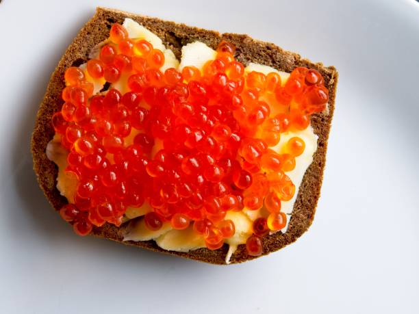 istock Red salmon caviar on the toast with butter 1368063238