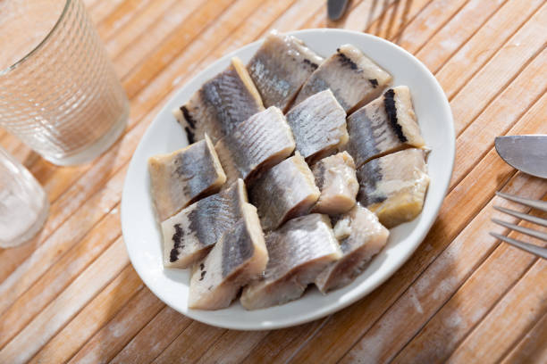 istock Pieces of chopped herring served on plate 1368063407