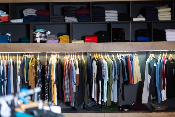 istock Assorted casual clothes on shelves and hangers 1368063436