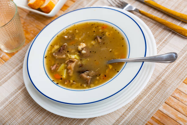 istock Rustic style mushroom soup in meat stock with pork and vegetables 1368063473