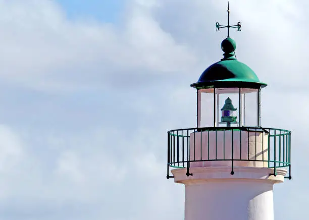 Photo of Lighthouse tower top and cloudscape, Sauzon harbour, Belle Ile, France