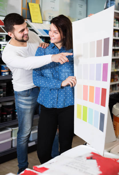 istock Couple in paint supplies store 1368065620