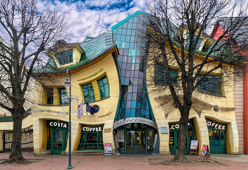 Sopot, Poland - January 19, 2022:  street in Sopot and funny twisted architecture of Crooked House, coffee shop and tourist attraction
