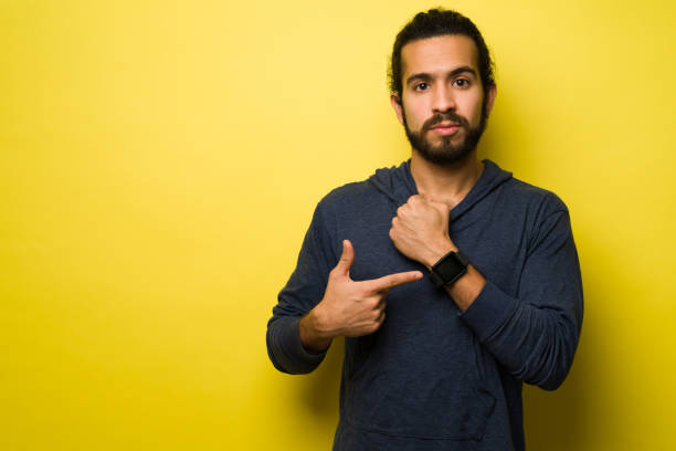 istock Handsome man pointing to the time 1368067265