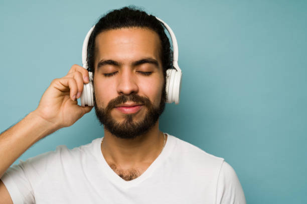 istock Attractive man enjoying music 1368067302
