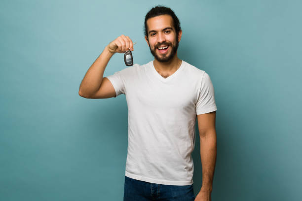 istock Happy man leasing a new car 1368067427