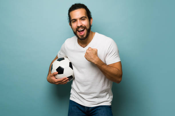 istock Excited young man loves soccer 1368067490