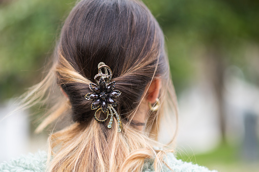Rear view of a woman wearing ornate hair jewelry