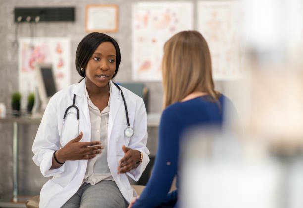 istock Doctor Talking with a Female Patient 1368068509