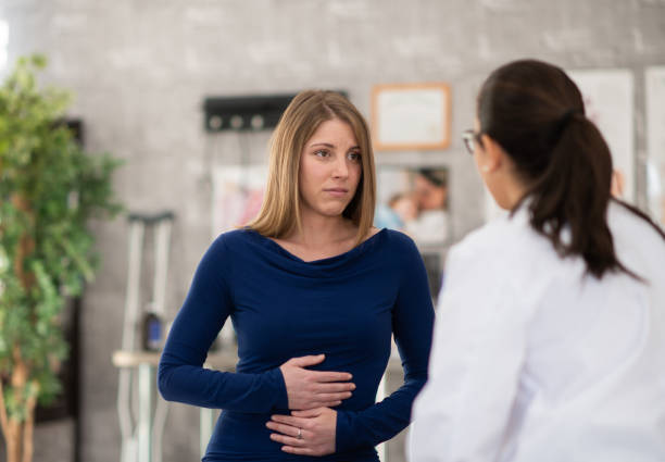 istock Female Patient at the Doctors 1368068510