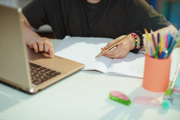 istock Modern pupil having distance education at home in sunny day 1368072072