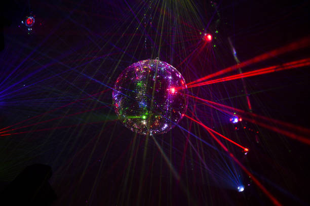 istock Mirrored Disco Ball and bright beams at the night party 1368073142