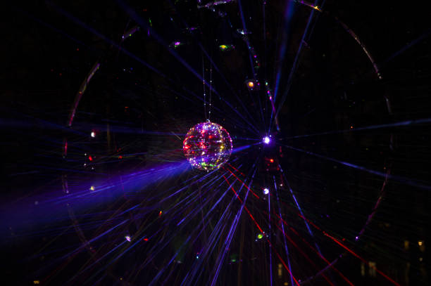 istock Mirrored Disco Ball and bright beams at the night party 1368073210