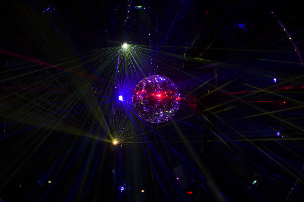 istock Mirrored Disco Ball and bright beams at the night party 1368073223