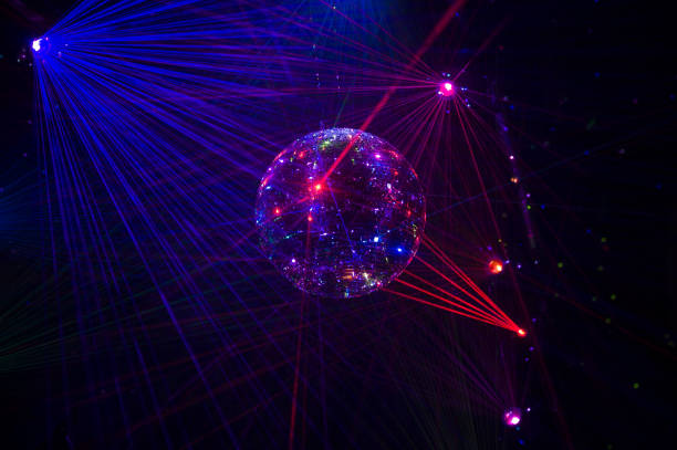 istock Mirrored Disco Ball and bright beams at the night party 1368073401