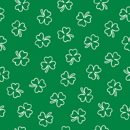 Vector seamless pattern of white outline clover leaves on a green square background.