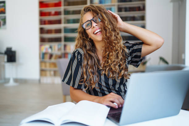 istock Young woman at home  working with laptop. 1368074954