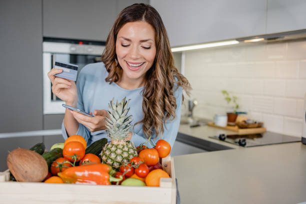 istock Ordering groceries online and paying contactless 1368075130