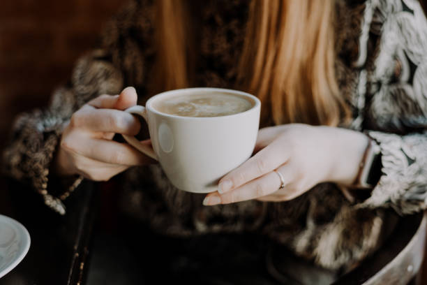 istock woman with ginger hair drinking coffee 1368077168