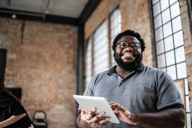 istock Portrait of a business man using digital tablet in an office 1368082644