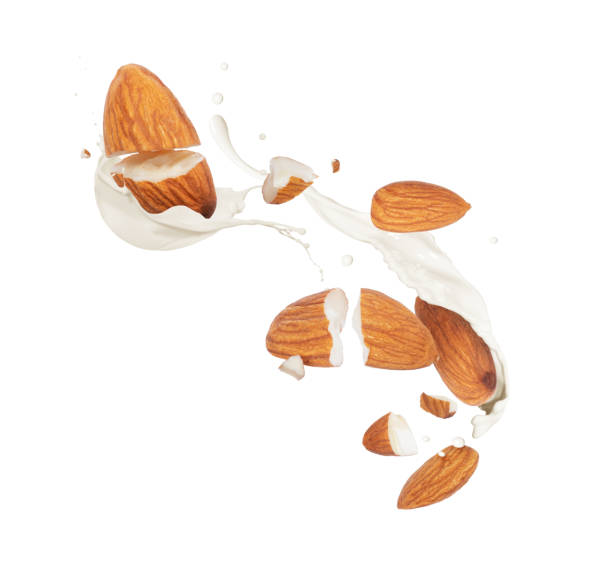 istock Crushed dried almonds with milk splashes in the air on a white background 1368082695