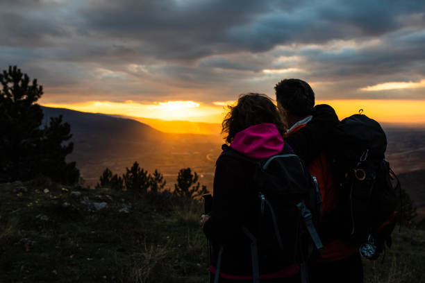istock A senior hiking couple watching a magnificent sunset 1368083257