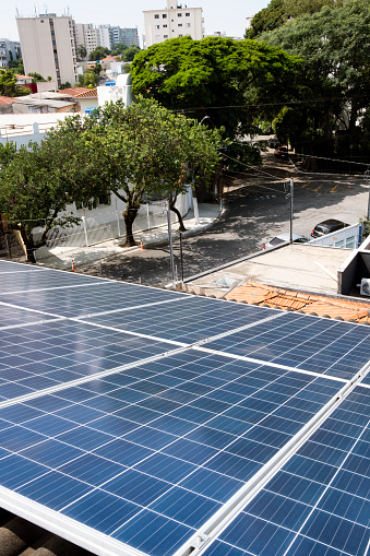 Solar panels or solar cells installed on the roof of a dwelling in Sao Paulo, Brazil, eco technology for electric power.