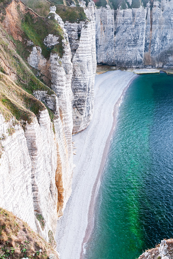 View on the beach and limestone cliffs on the alabaster coast of Normandy in Etretat