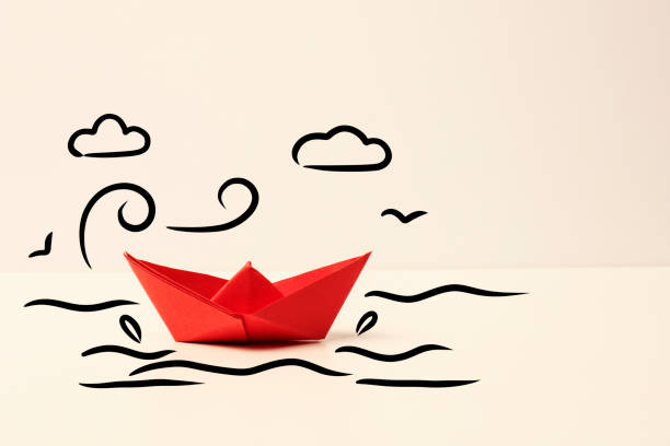 Paper ship with wind and cloud drawings Paper ship with wind and cloud drawings toy boat stock pictures, royalty-free photos & images