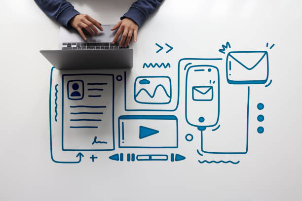 a woman is traying to create digital content on her laptop with line icons - contente imagens e fotografias de stock