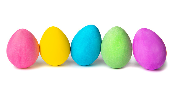 Easter colored eggs in a wicker bag. Easter composition. High quality photo
